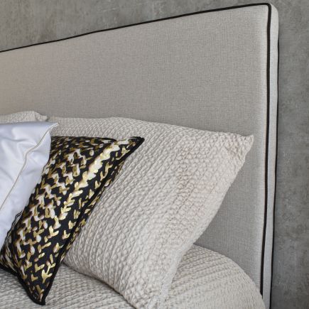 Gray upholstered headboard with 'Riga' edging | Procomobel